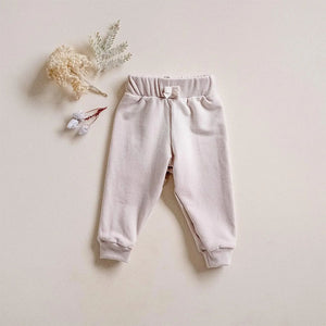 Infant and toddler cuffed jogger lounge pant fleece bamboo cotton in oat.