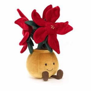 Plush red and gold poinsettia plant with brown corduroy feet and smiling face.