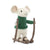 White plush mouse in a green sweater standing on skiis.