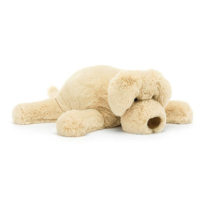 A soft beige, floppy puppy dog with a big brown velvet nose.